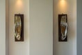 Two open palm hands of buddha - decorative modern art sculpture elements of interior on the wall Royalty Free Stock Photo