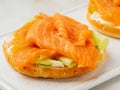 Two open sandwiches with salmon, cream cheese, cucumber slices o Royalty Free Stock Photo