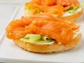 Two open sandwiches with salmon, cream cheese, cucumber slices o Royalty Free Stock Photo