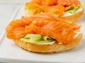 Two open sandwiches with salmon, cream cheese, cucumber slices o Royalty Free Stock Photo