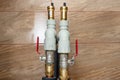 Two open three-quarter inch valves installed in the heat pump installation, plastic elbows visible. Royalty Free Stock Photo