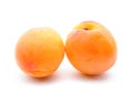 Two apricots close-up on white background Royalty Free Stock Photo