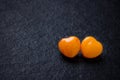 Two orange heart shaped pills or candy on grunge Royalty Free Stock Photo
