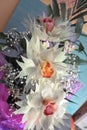 Two Orchid closeup of a bouquet of three orchids beautifully decorated on wooden background concept birthday flowers