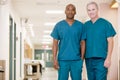 Two Orderlies Standing In A Hospital Corridor Royalty Free Stock Photo