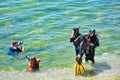 Two original divers and two amateur divers