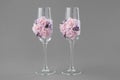 Two ornate wedding wine glasses decorated with lace and pink roses. Royalty Free Stock Photo