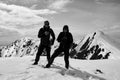 Two other tourists on the snow-capped mountain top Royalty Free Stock Photo