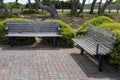 Two outdoor brown wooden benches