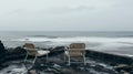 Two outdoor lounge chairs next to sea