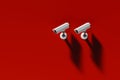 two outdoor surveillance cameras on a red wall, security system Royalty Free Stock Photo