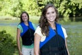 Two outdoorsy females with life jackets Royalty Free Stock Photo