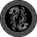 Two outline dragons in black ornamented circle or plate