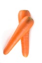 Two overlapping fresh orange carrots isolated on white background in strange appearance, vertical picture Royalty Free Stock Photo