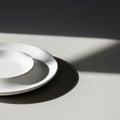 Two overlapping white ceramic plates arranged Royalty Free Stock Photo