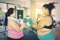 Overweight women doing workout at gym Royalty Free Stock Photo