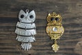 Two Owls Pendant Necklace on Rustic Wooden Background Royalty Free Stock Photo