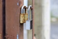 Two padlocks on the old and rusted iron dash Royalty Free Stock Photo