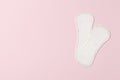 Two pads on a pink background. Ovulation concept. menstruation concept Royalty Free Stock Photo