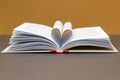 Open book with pages forming heart shape. Heart made with book pages Royalty Free Stock Photo