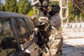 Two paintball players hiding Royalty Free Stock Photo