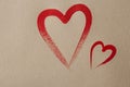 Two Painted heart outline on craft paper background