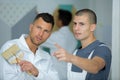 two painters on site pointing at something Royalty Free Stock Photo