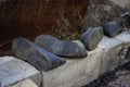 Two pair of old dirty galoshes on bricks