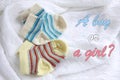 Two pairs of baby socks: blue and yellow striped Royalty Free Stock Photo