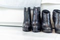 two pairs of black boots with high heels in front of a white closet Royalty Free Stock Photo