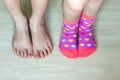 Two pairs of children legs closeup with socks