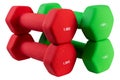 Two pairs of colored dumbbells in a coating, on a white background