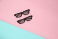 Two pairs of 3d glasses on a pink blue pastel background. Top view. Minimalism. Royalty Free Stock Photo