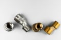 Two pairs of eccentrics connectors in brass and stainless steel. Royalty Free Stock Photo