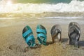 Two pairs of flip-flops on the beach, tropical holiday concept, sunlight Royalty Free Stock Photo