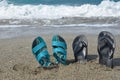 Two pairs of flip-flops on the beach, tropical vacation concept Royalty Free Stock Photo