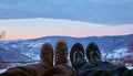 A friend and I look at a beautiful sunset in the winter mountains