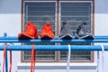 Two pairs of running shoes, red and grey, putted on the cloths hanger Royalty Free Stock Photo