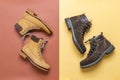 Two pairs of yellow and brown men`s and women`s winter suede leather stylish boots on color background. Casual trendy footwear, Royalty Free Stock Photo