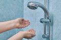 Two palm of hands under water stream from shower. Royalty Free Stock Photo