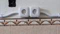 Two Panasonic Electrical Outlets Installed on Tiled Wall Royalty Free Stock Photo
