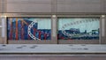 Two panels of a five panel tile mural on the outside of a building on Bryan Street in downtown Dallas, Texas.