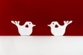 Two paper birds with hearts on a red background Royalty Free Stock Photo