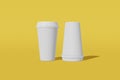 Two paper cups mockup with a lid on a yellow background. One of the cups is turned upside down. 3D rendering Royalty Free Stock Photo