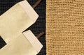 Two paper envelopes on a seamless knitted pattern. Raffia is a genus of plants of the Palm family, ECO material Royalty Free Stock Photo