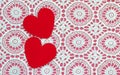 Two hearts on a white doily against a pink background Royalty Free Stock Photo