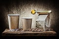 Two papr cups and bag with coffee spoon beans Royalty Free Stock Photo