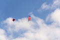 Two parachutists skydiving with colorful parachute clouds blue sky background Royalty Free Stock Photo