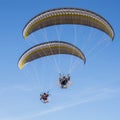 Two paraglider blue sky moto