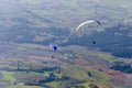 Two paraglider flying over the valley on a summer sunny day Royalty Free Stock Photo